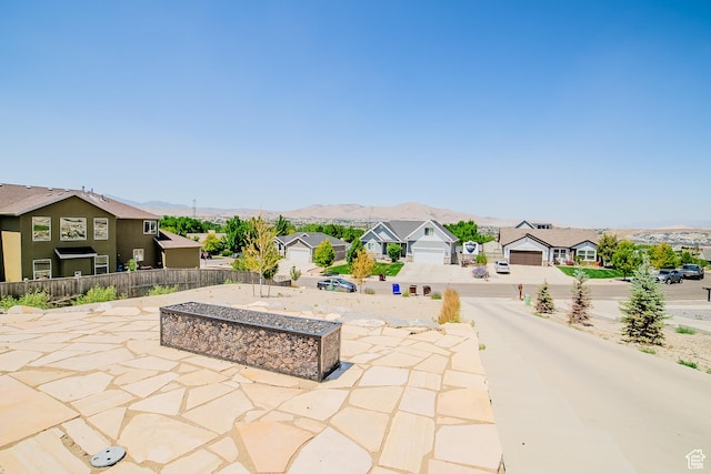 3698 E Butterfield Rd, Eagle Mountain, UT 84005 - view of patio / terrace with a residential view and a mountain view