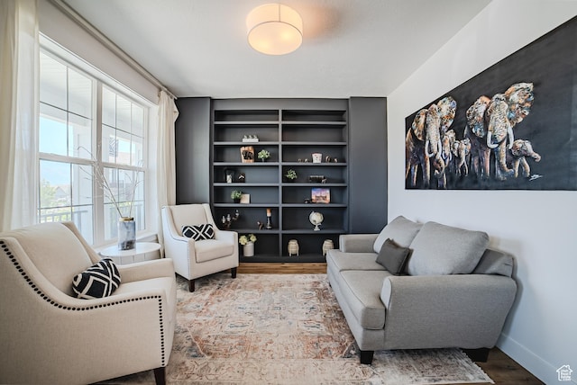 3698 E Butterfield Rd, Eagle Mountain, UT 84005 - living area featuring built in shelves and wood finished floors
