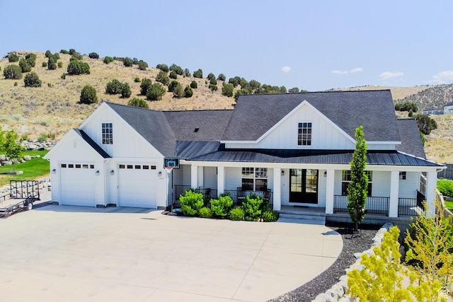 3698 E Butterfield Rd, Eagle Mountain, UT 84005 - modern farmhouse style home with board and batten siding, a porch, a standing seam roof, and a metal roof