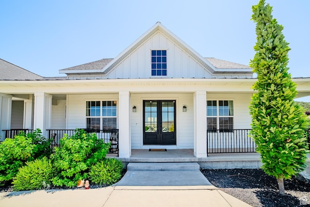 3698 E Butterfield Rd, Eagle Mountain, UT 84005 - doorway to property featuring board and batten siding, a porch, and a shingled roof