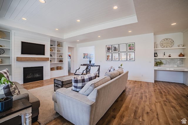 3698 E Butterfield Rd, Eagle Mountain, UT 84005 - living area with wood finished floors, recessed lighting, a large fireplace, and built in features