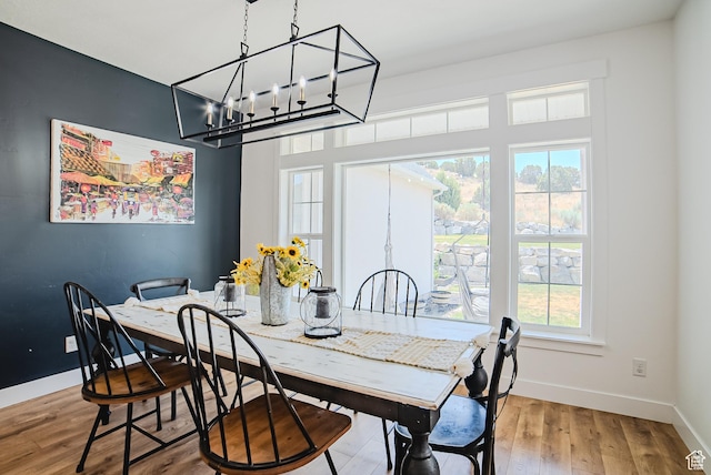 3698 E Butterfield Rd, Eagle Mountain, UT 84005 - dining area with wood finished floors and a chandelier