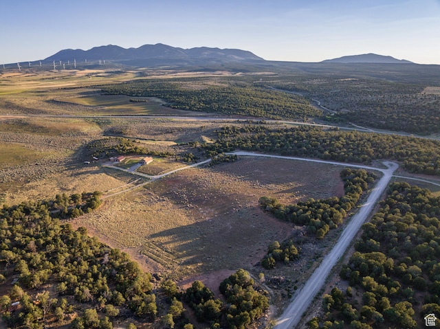 599 S Hideaway Cv S, Monticello, UT 84535 - aerial overview of property's location with a mountainous background and rural landscape