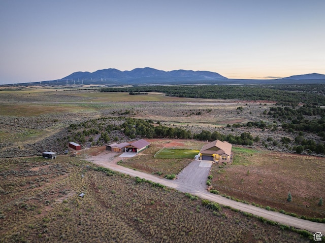 599 S Hideaway Cv S, Monticello, UT 84535 - aerial view at dusk of a mountain view and a view of countryside
