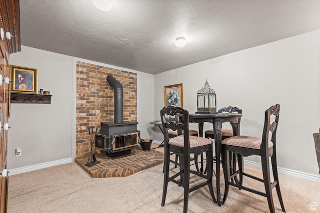 715 S 900 E, Orem, UT 84097 - carpeted dining space with a wood stove and a textured ceiling