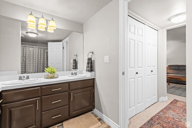 715 S 900 E, Orem, UT 84097 - bathroom featuring double vanity, a chandelier, and a closet