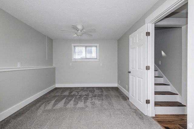 3320 N Plain City Rd W, Plain City, UT 84404 - unfurnished room featuring ceiling fan, dark carpet, and stairs