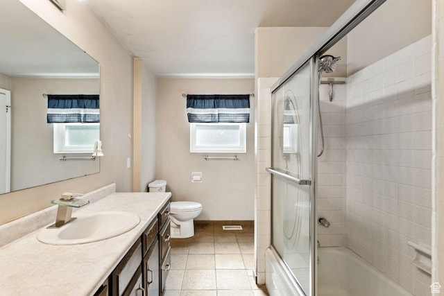 6924 S 2160 W, West Jordan, UT 84084 - bathroom with healthy amount of natural light, vanity, bath / shower combo with glass door, and tile patterned flooring