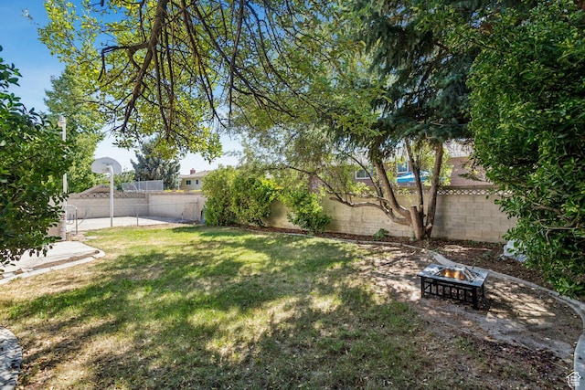 6924 S 2160 W, West Jordan, UT 84084 - fenced backyard with a fire pit