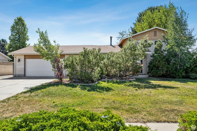 6924 S 2160 W, West Jordan, UT 84084 - view of property hidden behind natural elements featuring a garage, concrete driveway, brick siding, a front yard, and roof with shingles