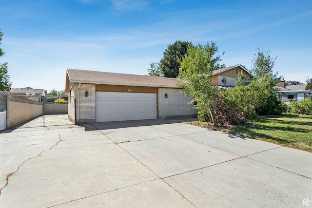 6924 S 2160 W, West Jordan, UT 84084 - view of front facade featuring brick siding, driveway, and an attached garage