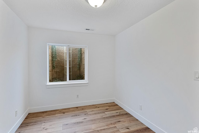 5958 W 8100 S, West Jordan, UT 84081 - unfurnished room featuring light wood finished floors and a textured ceiling