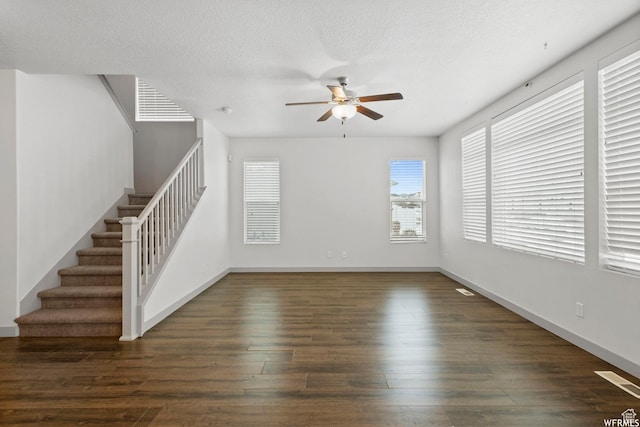 5958 W 8100 S, West Jordan, UT 84081 - unfurnished living room with a ceiling fan, stairs, wood finished floors, and a textured ceiling