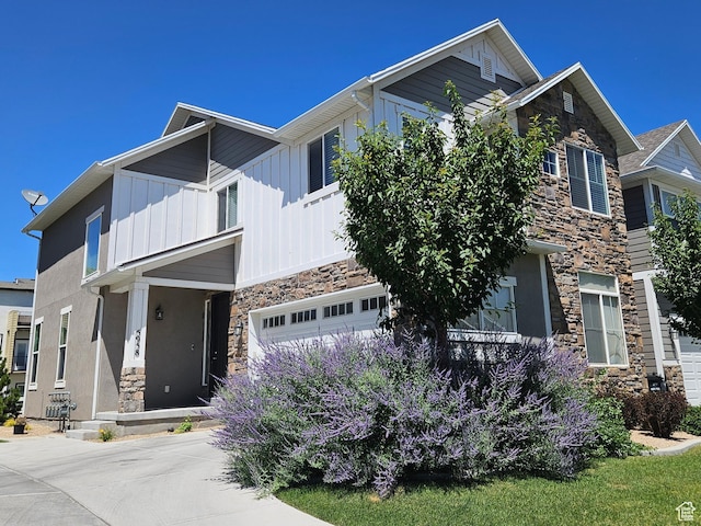 5958 W 8100 S, West Jordan, UT 84081 - craftsman house with stone siding, board and batten siding, an attached garage, and concrete driveway