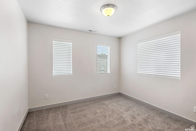 5958 W 8100 S, West Jordan, UT 84081 - carpeted spare room with baseboards and a textured ceiling
