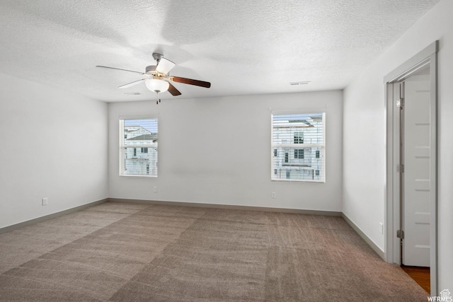 5958 W 8100 S, West Jordan, UT 84081 - carpeted empty room featuring plenty of natural light, ceiling fan, and a textured ceiling