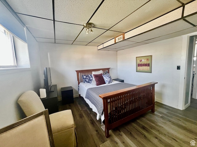 3917 S David Pl, West Valley City, UT 84119 - bedroom featuring a paneled ceiling and wood finished floors
