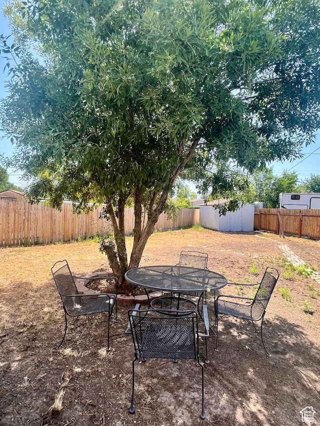 3917 S David Pl, West Valley City, UT 84119 - fenced backyard featuring outdoor dining area and a shed