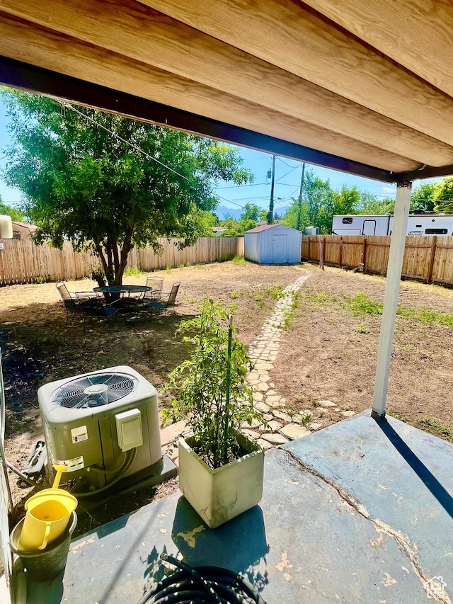 3917 S David Pl, West Valley City, UT 84119 - fenced backyard with a patio area and a storage unit