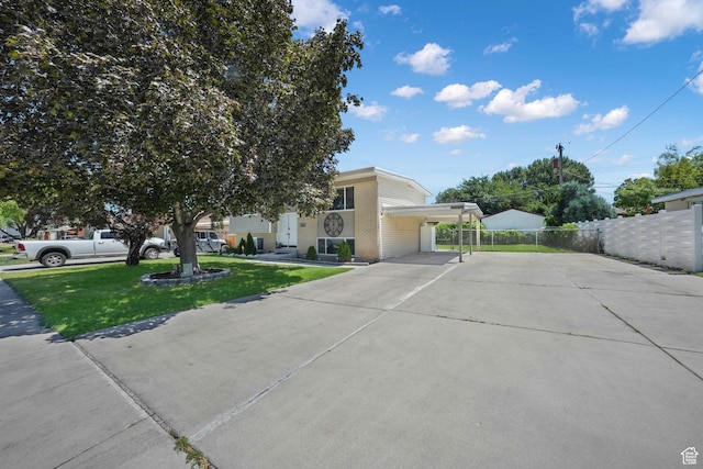 4245 S 3760 W, West Valley City, UT 84120 - view of front of house featuring driveway and a carport