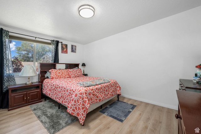 4245 S 3760 W, West Valley City, UT 84120 - bedroom with light wood-type flooring and baseboards