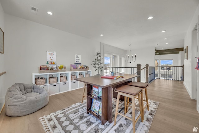 3728 W Chalgrove Rd, Taylor, UT 84401 - dining room featuring a chandelier, light wood finished floors, recessed lighting, and healthy amount of natural light