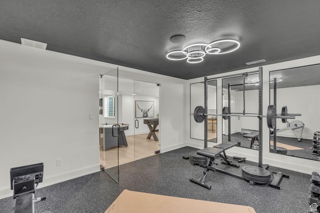 3728 W Chalgrove Rd, Taylor, UT 84401 - exercise area featuring a textured ceiling and a chandelier
