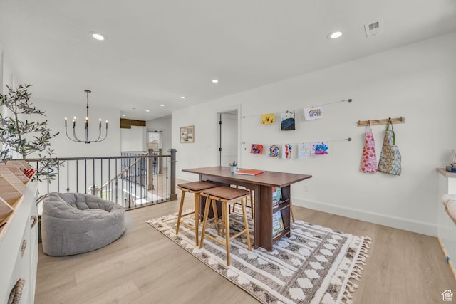 3728 W Chalgrove Rd, Taylor, UT 84401 - dining room with wood finished floors, a chandelier, and recessed lighting