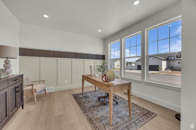 3728 W Chalgrove Rd, Taylor, UT 84401 - office with light wood-style flooring, recessed lighting, a decorative wall, and wainscoting