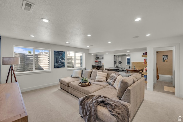3728 W Chalgrove Rd, Taylor, UT 84401 - living room with light colored carpet, recessed lighting, and a textured ceiling
