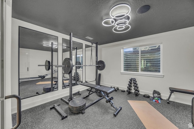3728 W Chalgrove Rd, Taylor, UT 84401 - workout area featuring baseboards and a textured ceiling