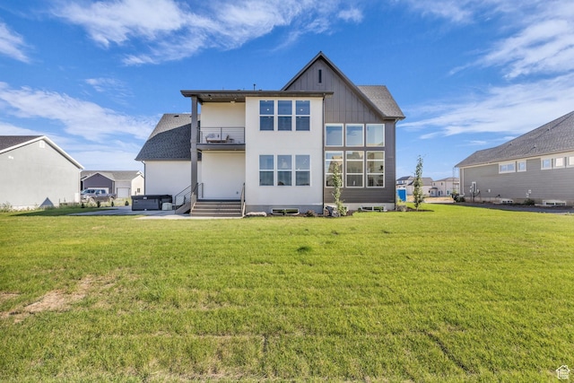 3728 W Chalgrove Rd, Taylor, UT 84401 - back of property with a balcony, board and batten siding, and a yard