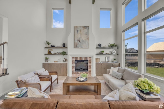 3728 W Chalgrove Rd, Taylor, UT 84401 - living area with a high ceiling, a brick fireplace, and wood finished floors