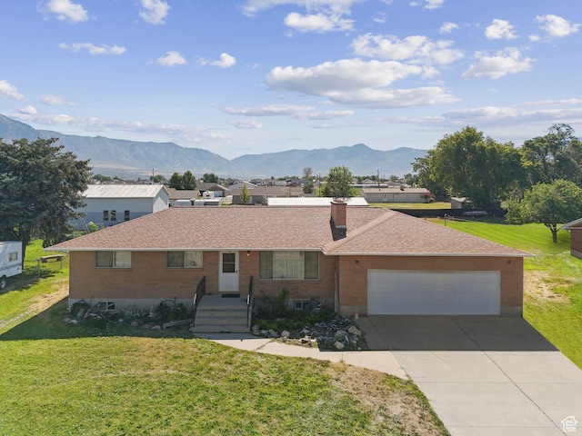 2690 N 4275 W, Plain City, UT 84404 - ranch-style home featuring a chimney, a front lawn, concrete driveway, and a mountain view