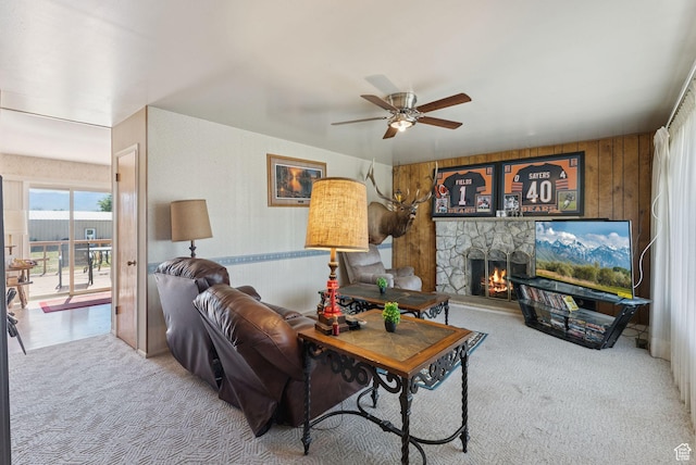 2690 N 4275 W, Plain City, UT 84404 - carpeted living room with a ceiling fan, a fireplace, and wood walls