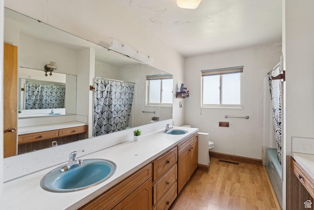 2690 N 4275 W, Plain City, UT 84404 - full bath featuring double vanity, wood finished floors, and shower / tub combo with curtain