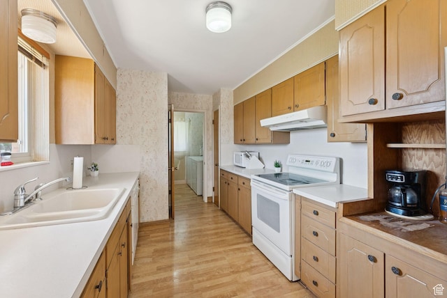 2690 N 4275 W, Plain City, UT 84404 - kitchen with white range with electric cooktop, under cabinet range hood, light wood-style flooring, light countertops, and plenty of natural light