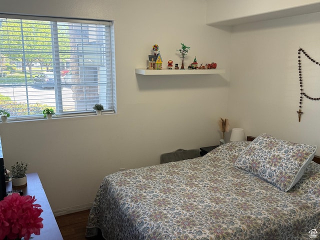1616 W Vivante Way Unit A3, West Valley City, UT 84119 - bedroom with dark wood-style floors and baseboards