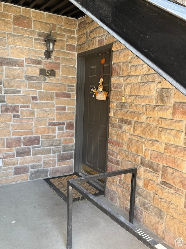 1616 W Vivante Way Unit A3, West Valley City, UT 84119 - doorway to property with brick siding