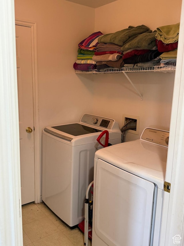 1616 W Vivante Way Unit A3, West Valley City, UT 84119 - washroom featuring separate washer and dryer and light floors