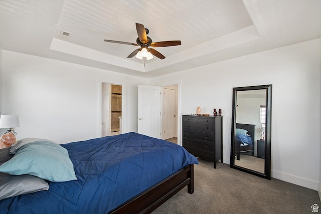 3902 W Pilton Ct, Taylorsville, UT 84129 - bedroom featuring a raised ceiling, carpet, ensuite bathroom, and ceiling fan