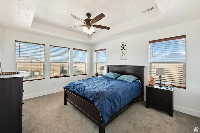 3902 W Pilton Ct, Taylorsville, UT 84129 - bedroom with a raised ceiling, light colored carpet, a textured ceiling, and a ceiling fan