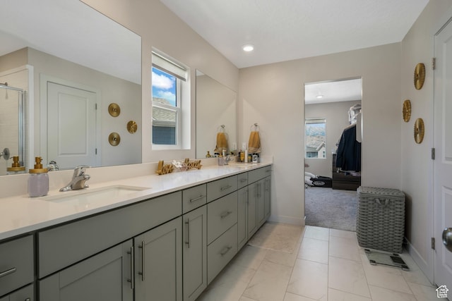 537 W Flora Dr, Saratoga Springs, UT 84045 - bathroom featuring double vanity, a tile shower, ensuite bathroom, and recessed lighting