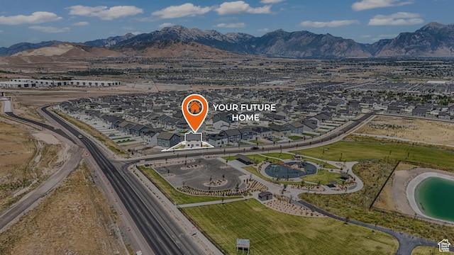 537 W Flora Dr, Saratoga Springs, UT 84045 - aerial overview of property's location featuring a mountain backdrop and nearby suburban area