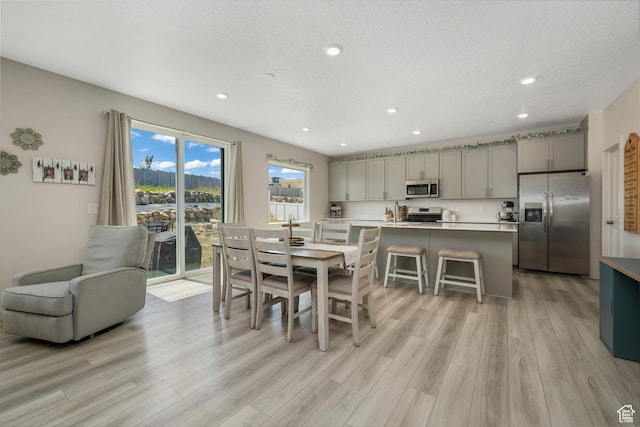 537 W Flora Dr, Saratoga Springs, UT 84045 - dining space featuring light wood-style flooring and recessed lighting