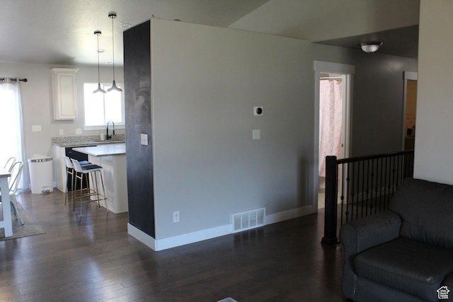 2359 E Prairie Ln, Eagle Mountain, UT 84005 - living area featuring dark wood-style floors and baseboards