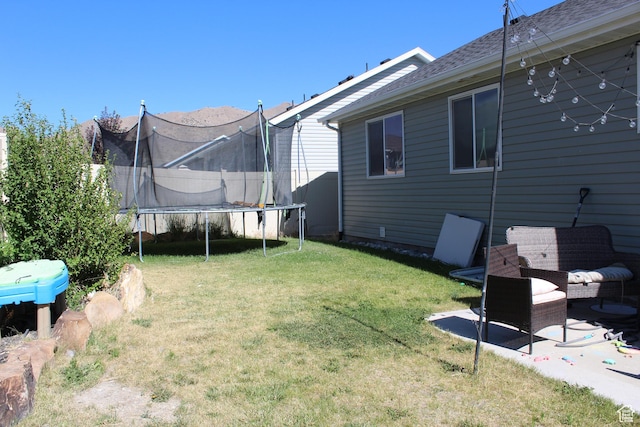 2359 E Prairie Ln, Eagle Mountain, UT 84005 - view of grassy yard featuring a trampoline