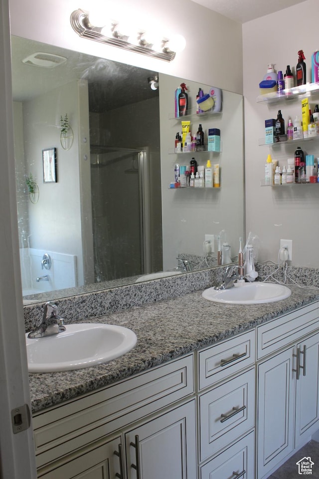 2359 E Prairie Ln, Eagle Mountain, UT 84005 - bathroom featuring double vanity and a stall shower