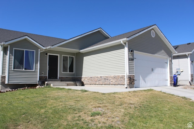 2359 E Prairie Ln, Eagle Mountain, UT 84005 - single story home with an attached garage, a front yard, driveway, and stone siding