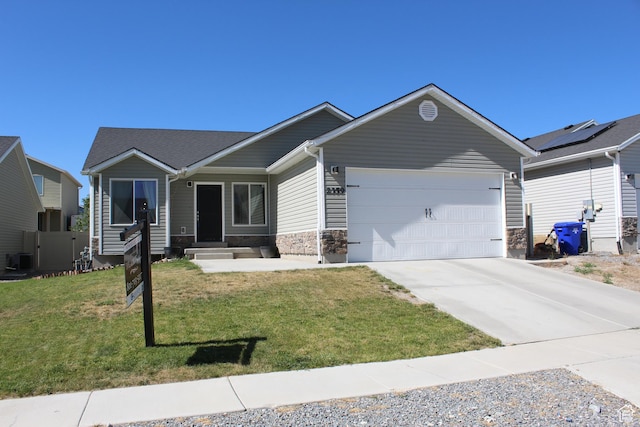 2359 E Prairie Ln, Eagle Mountain, UT 84005 - single story home with a garage, concrete driveway, and stone siding